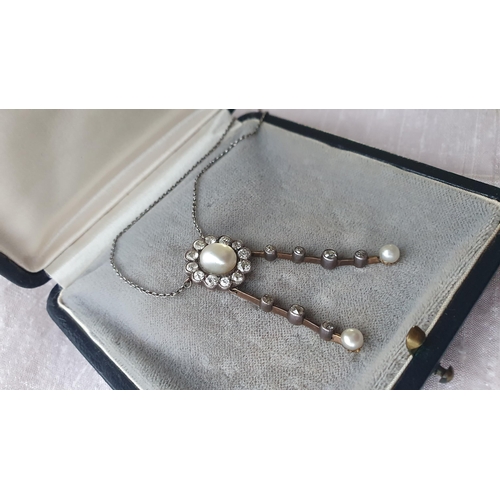 210 - An early 20th Century Pearl and Diamond Negligée Necklace the principle baroque pearl within a frame... 