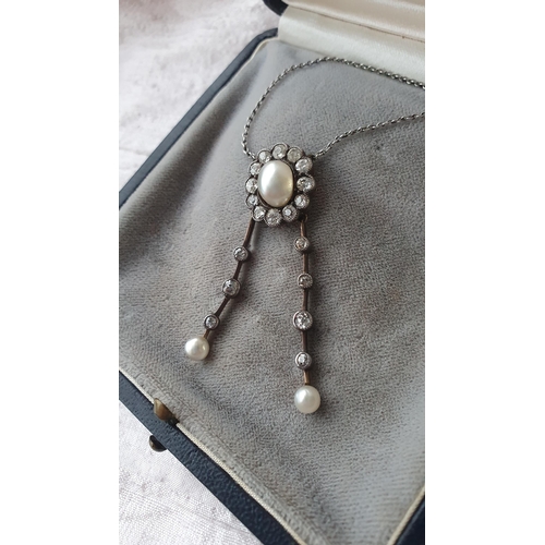 210 - An early 20th Century Pearl and Diamond Negligée Necklace the principle baroque pearl within a frame... 