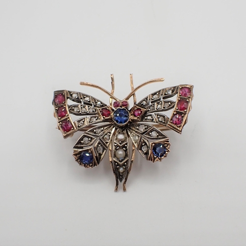 220 - A Sapphire, Ruby, Pearl and Diamond Butterfly Brooch with round sapphire and seed pearls to body and... 