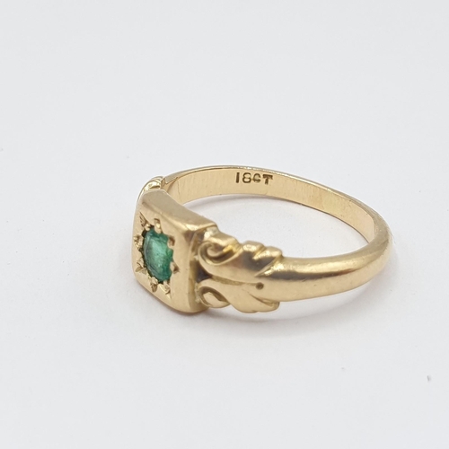 223 - An Emerald single stone Ring set round stone in square frame, stamped 18ct, ring size L