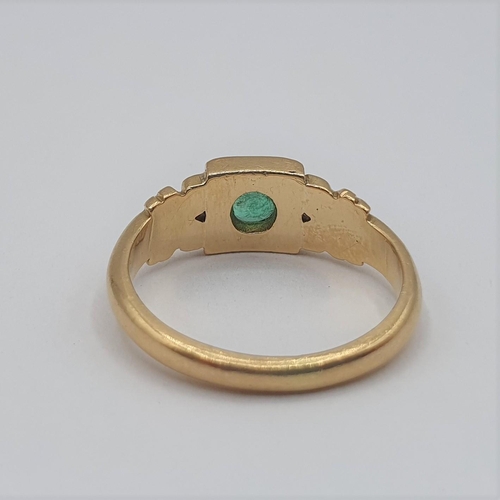 223 - An Emerald single stone Ring set round stone in square frame, stamped 18ct, ring size L