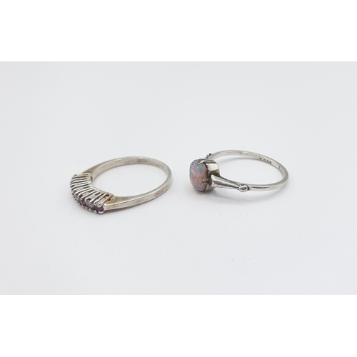 229 - A silver Ring set rubies and white stones and a Dress Ring set opalescent stone, stamped Sterling Si... 