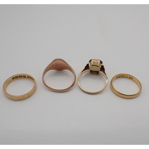 235 - A 22ct gold Wedding Band approx 2.40gms, an 18ct gold Wedding Band 2.50gms, a Signet Ring amd a Dres... 