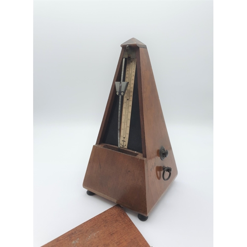 249 - A mahogany cased Metronome, 9in high