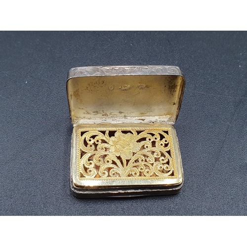 29 - A Victorian silver Vinaigrette with floral and scroll engraving, vacant cartouche, the gilt grille w... 