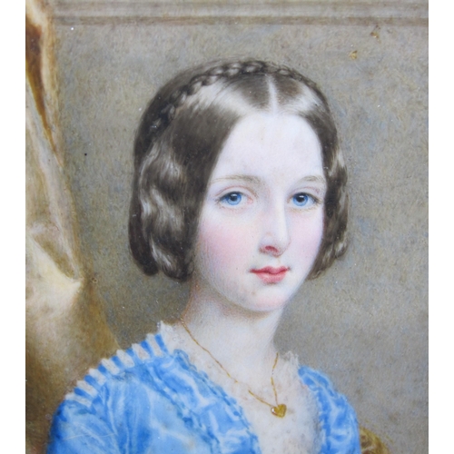 262 - ENGLISH SCHOOL CIRCA 1850. Portrait miniature of a Lady, half length, wearing a blue Dress, a pillar... 