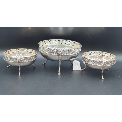 10 - A Garniture of three early 20th Century circular Bowls with pierced fruiting vine and bead friezes, ... 