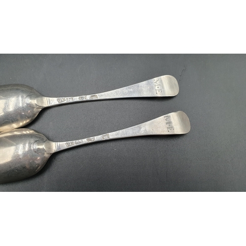 111 - A pair of George II silver bottom marked Table Spoons Hanoverian pattern engraved initials M.E, Lond... 