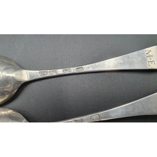 111 - A pair of George II silver bottom marked Table Spoons Hanoverian pattern engraved initials M.E, Lond... 