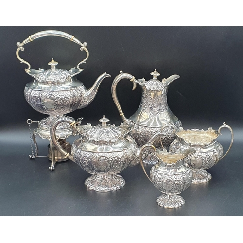 116 - A George V silver five piece Tea and Coffee Service with floral embossing, rococo cartouches engrave... 