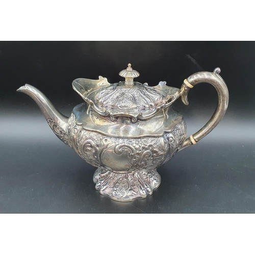 116 - A George V silver five piece Tea and Coffee Service with floral embossing, rococo cartouches engrave... 