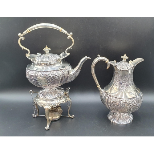 116 - A George V silver five piece Tea and Coffee Service with floral embossing, rococo cartouches engrave... 