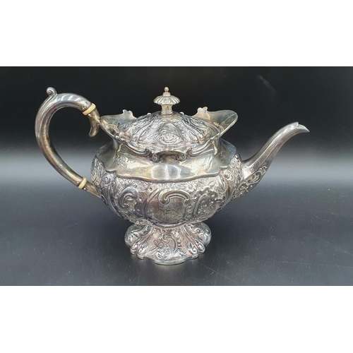 116 - A George V silver five piece Tea and Coffee Service with floral embossing, rococo cartouches engrave... 