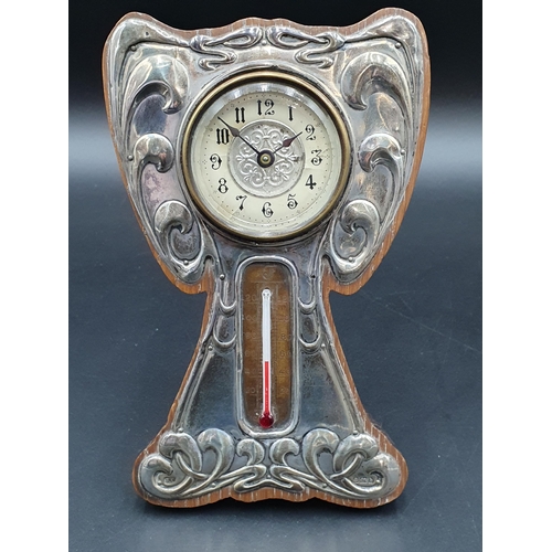 21 - An Edward VII Art Nouveau silver mounted Clock and Thermometer with embossed design, Birmingham 1907... 