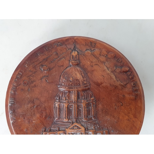 252 - A 19th Century French pressed wood circular Tobacco Box with relief design of a cathedral surrounded... 