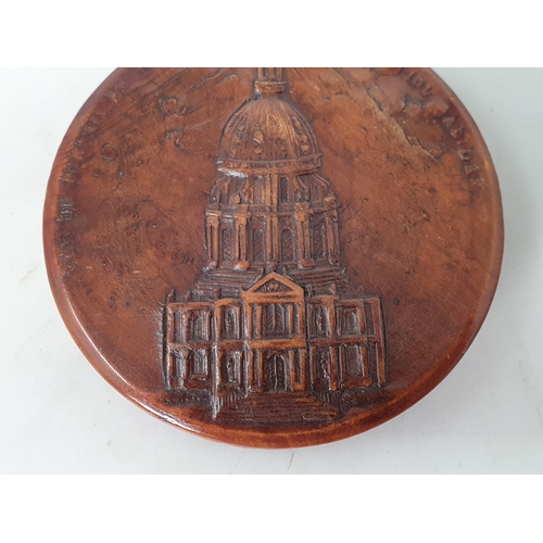 252 - A 19th Century French pressed wood circular Tobacco Box with relief design of a cathedral surrounded... 