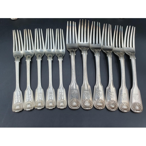 28 - A matched part set of 19th Century silver Cutlery fiddle, thread and shell pattern engraved eagle cr... 