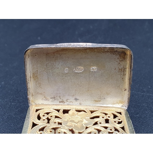 29 - A Victorian silver Vinaigrette with floral and scroll engraving, vacant cartouche, the gilt grille w... 