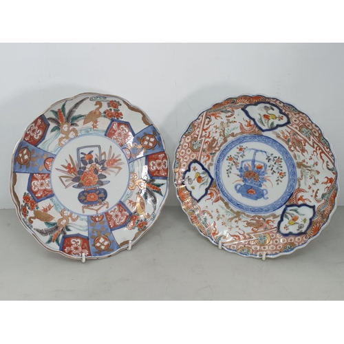 302 - Two Imari Plates with painted floral, bird and dragon designs in red, blue and gilt paints, both wit... 