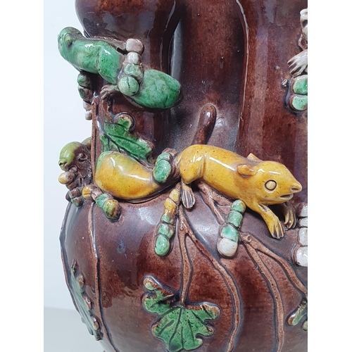 307 - A brown glazed Chinese five necked Vase with applied coloured Squirrel and Vine decorations, with si... 