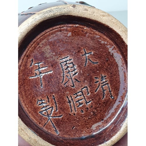 307 - A brown glazed Chinese five necked Vase with applied coloured Squirrel and Vine decorations, with si... 