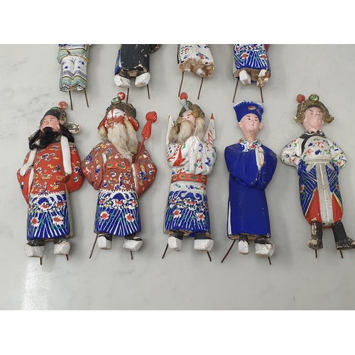 309 - Nine antique Chinese clay Dolls with moving heads dressed in traditional costume, some A/F 6in H app... 