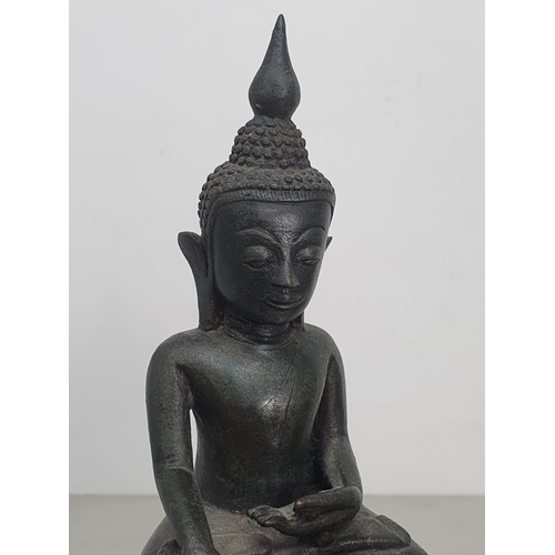 310 - A bronze Buddha in the seated position on decorative base, 6