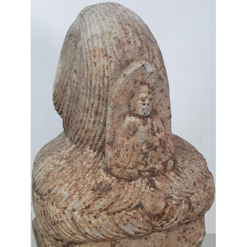 311 - A carved stone Buddha Head with later carved wooden associated Stand. A/F. (Head alone measures 11