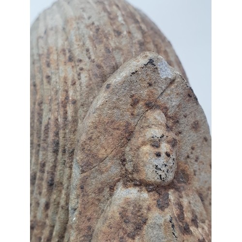 311 - A carved stone Buddha Head with later carved wooden associated Stand. A/F. (Head alone measures 11