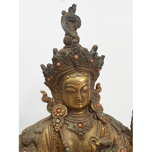 319 - A gilt bronze Figure of a ten armed Goddess Buddha Statue with coloured stone decorations, bearing s... 