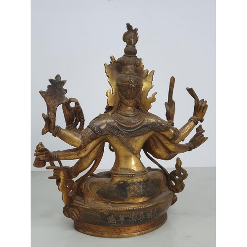 319 - A gilt bronze Figure of a ten armed Goddess Buddha Statue with coloured stone decorations, bearing s... 