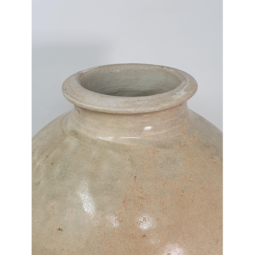 325 - A Chinese buff pottery Vase with partial clear glazing possibly Tang Dynasty, 11.5