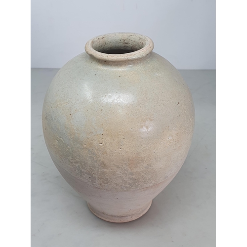 327 - A Chinese buff pottery Vase, the top half with clear glazing, the rim slightly uneven, possibly Tang... 