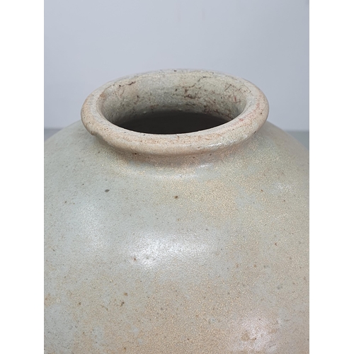 327 - A Chinese buff pottery Vase, the top half with clear glazing, the rim slightly uneven, possibly Tang... 