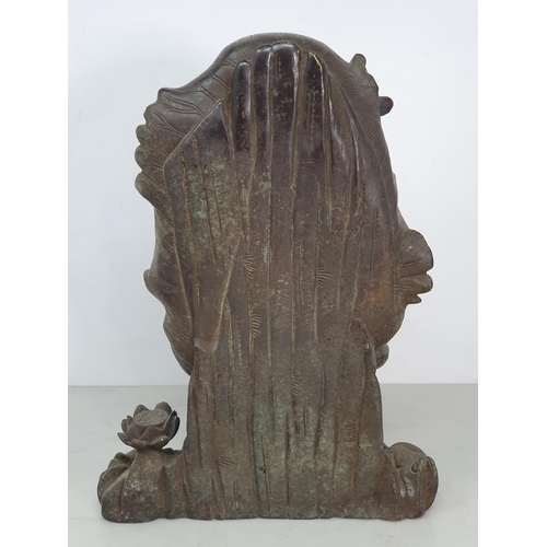 329 - A bronze Figure of a Seated Guan Yin Buddha in Lotus Leaf, 10.5