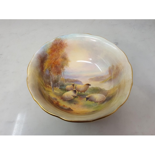 358 - A Royal Worcester Bowl painted four sheep in a landscape with trees and distant hills, signed H Stin... 