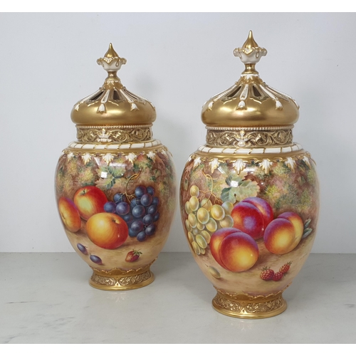 359 - A pair of Royal Worcester Pot Pourri lidded Vases with inner cover and outer lid having pierced deco... 