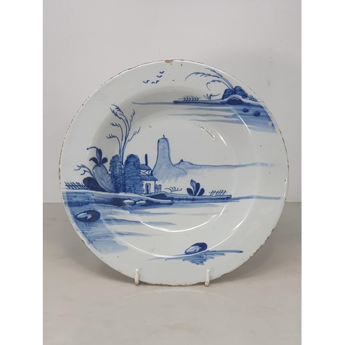 369 - Four Antique Delft blue and white Plates with painted landscapes, figures, etc.