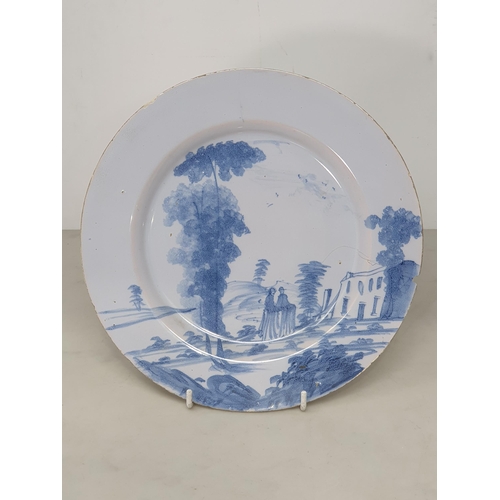 369 - Four Antique Delft blue and white Plates with painted landscapes, figures, etc.