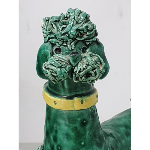 370 - A large Continental green glazed Pottery Poodle with simulated leather collar, 1ft 5