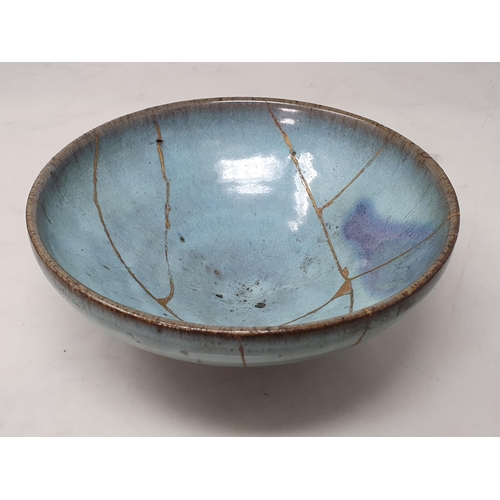 372 - A blue glazed Oriental Pedestal Bowl with gilt painted repairs/design, 8