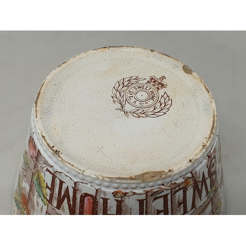 373 - A Faience pottery twin handled Pot Pourri with ten pierced holes, with floral panel decorations, 4