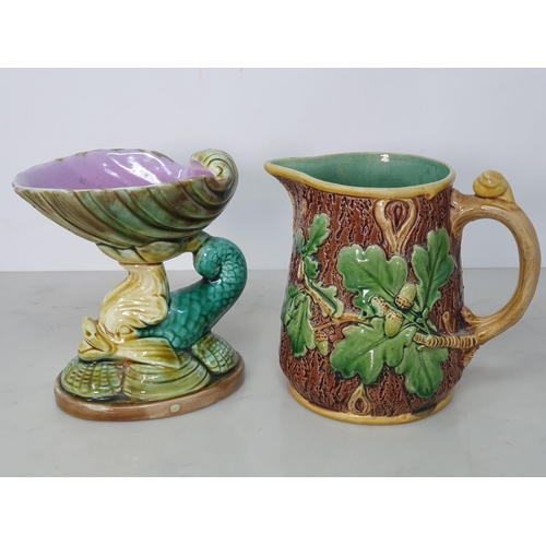 374 - A Majolica Jug in the form of an Owl with green branch and flower handle, A/F, 9.5