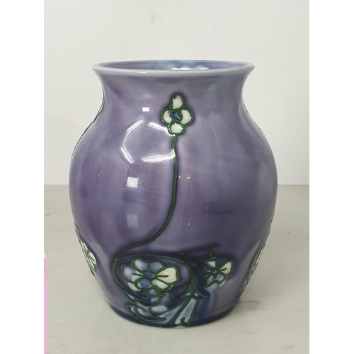 375 - A Minton purple glazed Secessionist Vase decorated with white and green flowers, bearing 