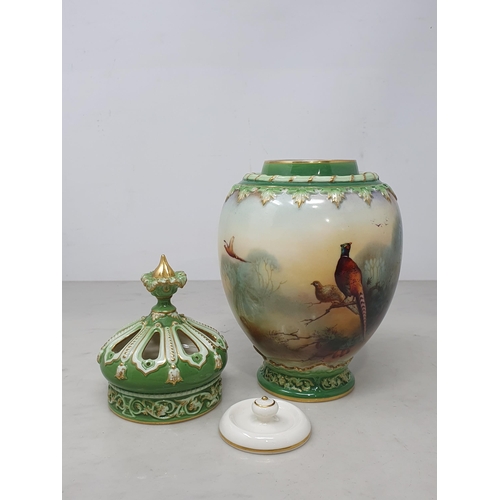 383 - A Royal Worcester Pot Pourri Vase having inner and outer covers, painted with Pheasant figures in a ... 