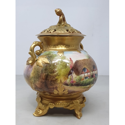 384 - A Royal Worcester Pot Pourri and cover with gilt branch moulded handles, painted a cottage scene, si... 