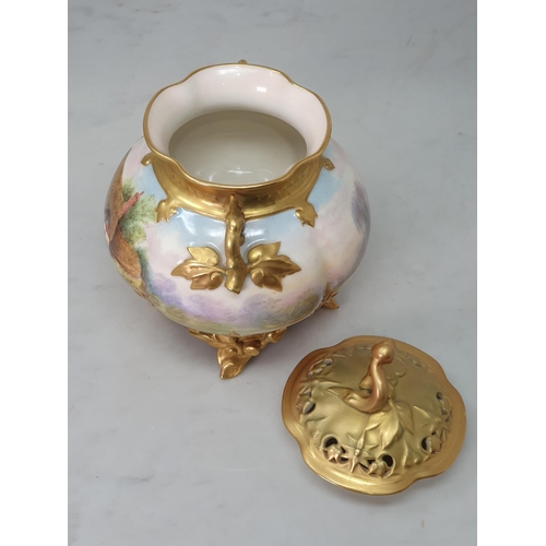 384 - A Royal Worcester Pot Pourri and cover with gilt branch moulded handles, painted a cottage scene, si... 