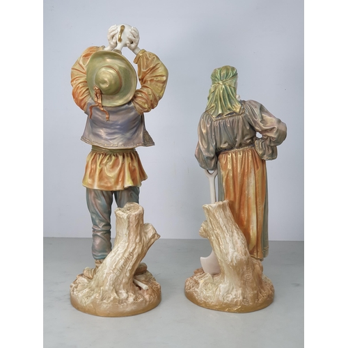 388 - A large pair of Royal Worcester shotsilk figures, a lady resting on a shovel and man drinking from a... 