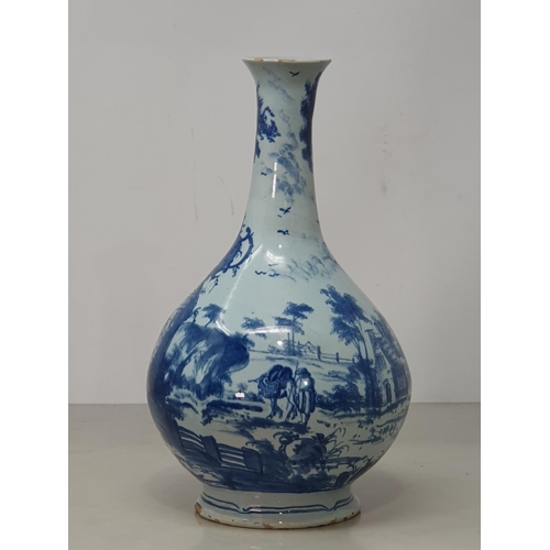 395 - An antique blue and white Delftware Vase, decorated with figures in Landscape with ornate Tree. 10.5... 