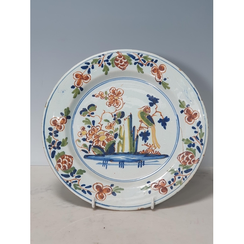 396 - Four Antique Delft Plates with polychrome decorations, one with Bird and Flowers, and three with Flo... 